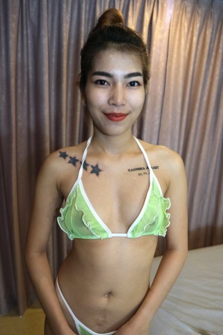 Cute Thai hooker Samai	posing her provocative lingerie and high heels