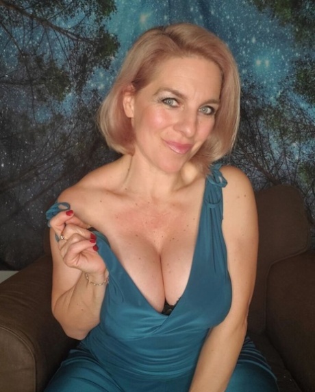 Stunning Mature Blonde Flaunts Her Huge Cleavage And Sexy Ass In A Solo