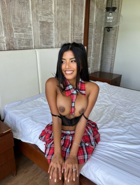OnlyFans Babe Tita Sahara Poses In Her Schoolgirl Outfit & Unveils Her Boobs