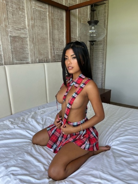 OnlyFans Babe Tita Sahara Poses In Her Schoolgirl Outfit & Unveils Her Boobs