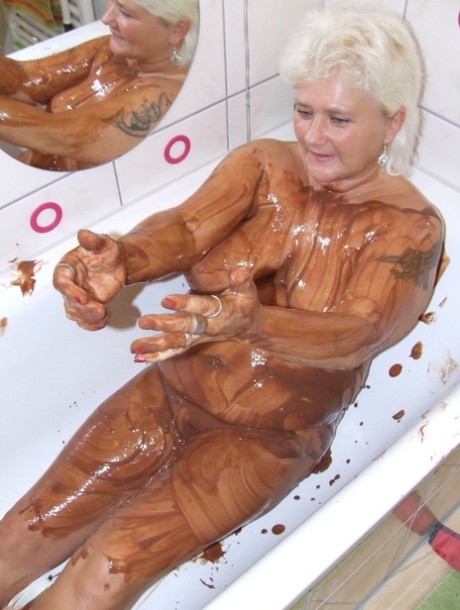 Fat Blonde Granny Katja Pours Chocolate Milk All Over Her Big Tits In The Tub