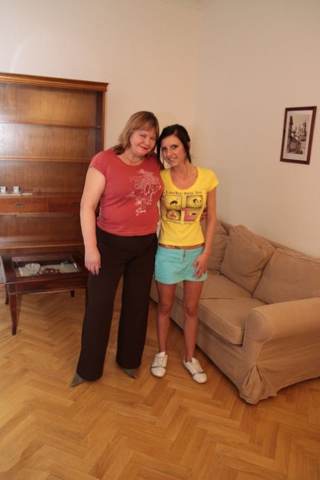 Ada, the young lesbian with a mature BBW Jeanie, wears a strapon dildo.