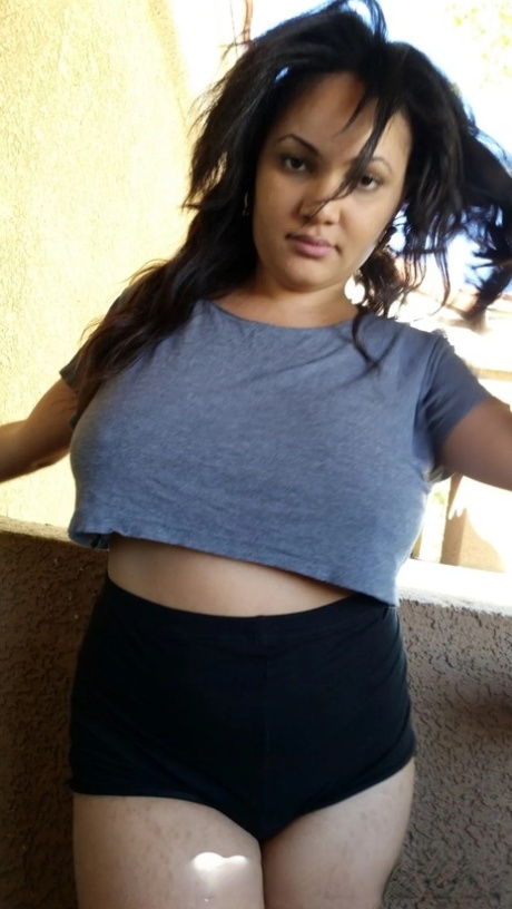 Chubby Ebony Amateur Posing Braless In Her Sexy Shirt On The Balcony