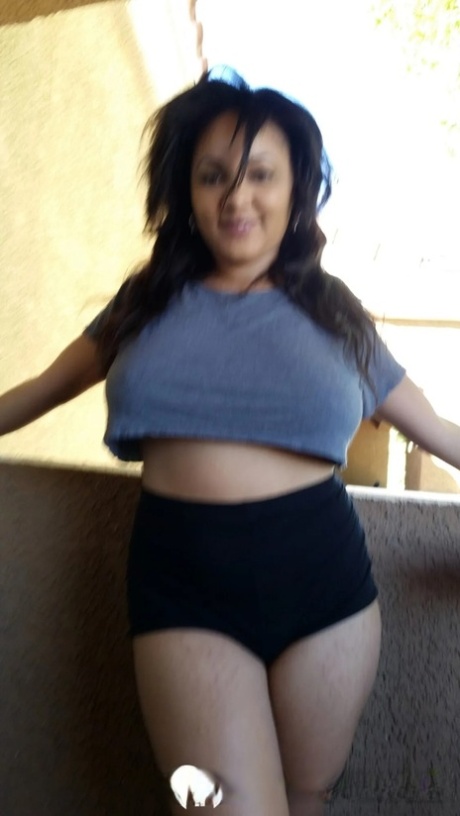 Chubby Ebony Amateur Posing Braless In Her Sexy Shirt On The Balcony