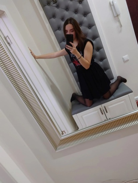 She exposes her petite frame in all the lingerie she has on, while also showing off her nude physique.