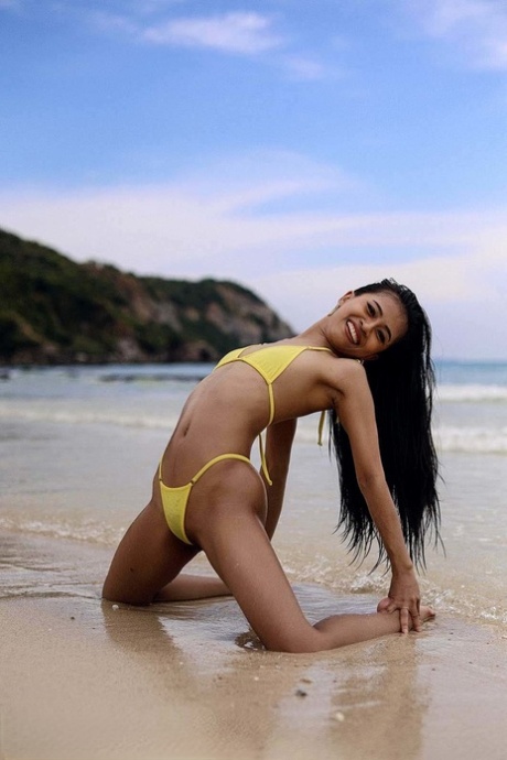 Attractive Asian Babe Posing In Her Sexy Yellow Bikini In A Solo