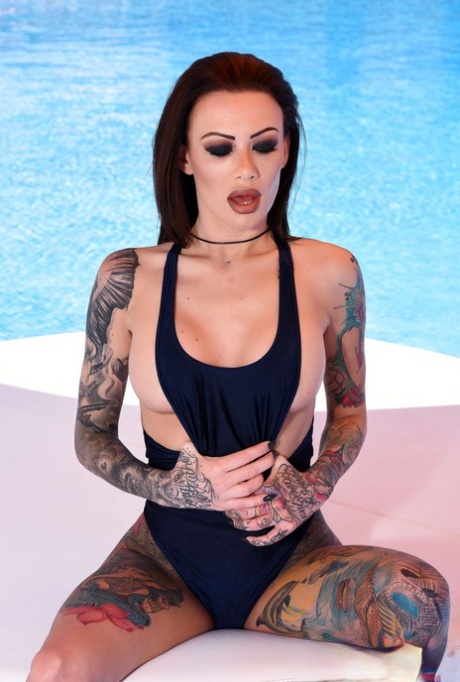Inked Redhead In A Bodysuit Becky Holt Reveals Her Tits And Poses Poolside