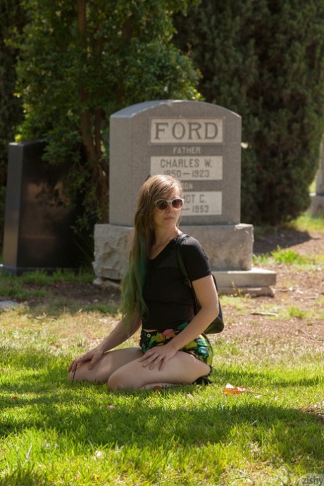 Naughty American teen Evelyn Bishop flashing an upskirt at the cemetery