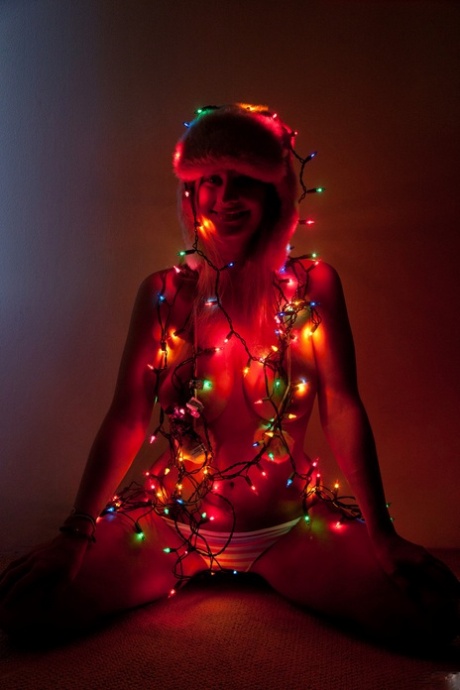 Teen girlfriend Alice Wonder grabbing her big natural tits in a Christmas solo