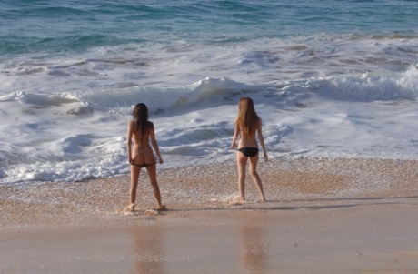 Amateur stars, Faye & Larysa (left) and (right) strip off in their bikinis at the beach.