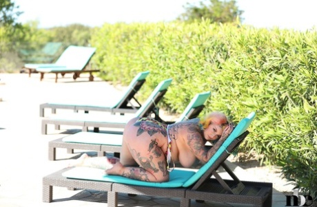 Snub: Cute BBW ditches her bright swimsuit outside and shows off the hot tattooed figure she's wearing.