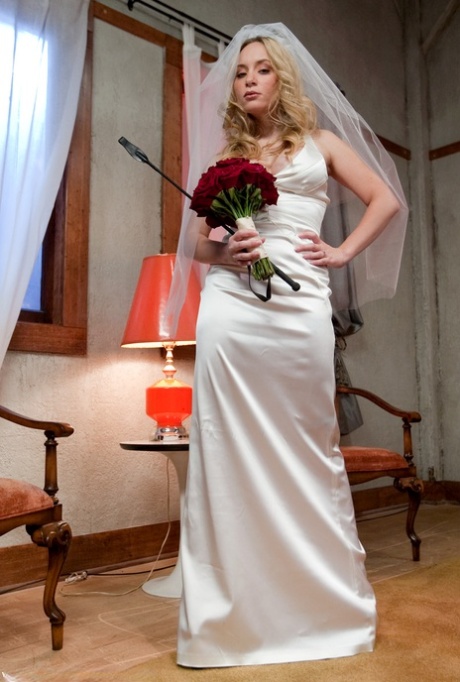 The bride who dominated Aiden Starr's outfit, grabs a long whip and taunts her adorable husband.