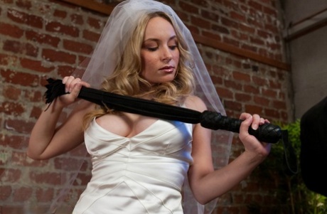 The bride who dominated Aiden Starr's outfit, grabs a long whip and taunts her adorable husband.