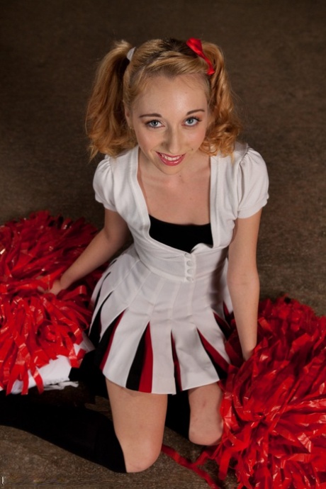 A small, tittered cheerleader named Emma Haize experiences a rough assault with her bare legs.