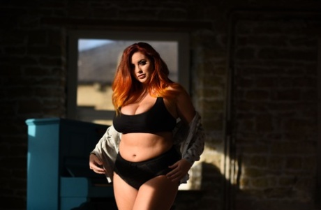 The thick model, Lucy Vixen strips with her lace panty and shows off huge breasts.
