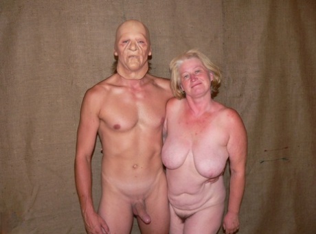 A kinky masked man causes an amateur mature titte Heloise to be rammed by her.