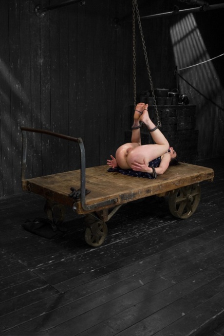 American babe Juliette March gets bound and fisted on a wooden wagon