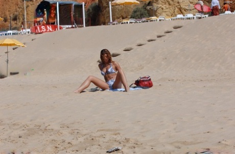 The amateurish sexwear-wearing Ivana is on the beach with her small buttocks in full display.