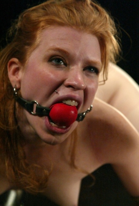 A machine dildo is used by Madison Young, a ball-gagged MILF, to brave the wild side of BDSM.