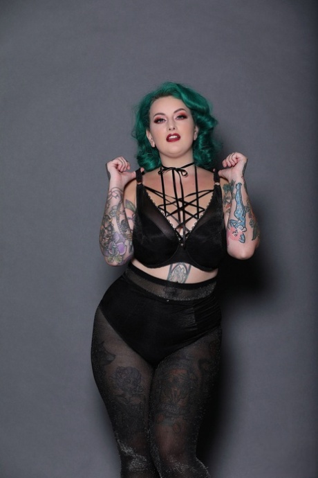 Green haired chubby babe Galda Lou shows her inked body and big tits