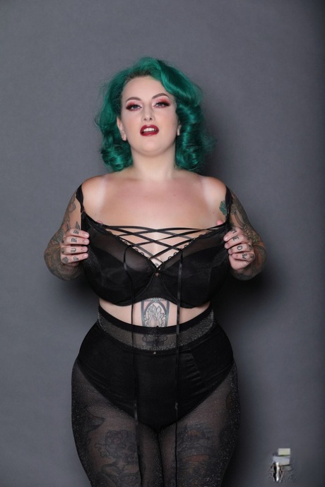 Green haired chubby babe Galda Lou shows her inked body and big tits