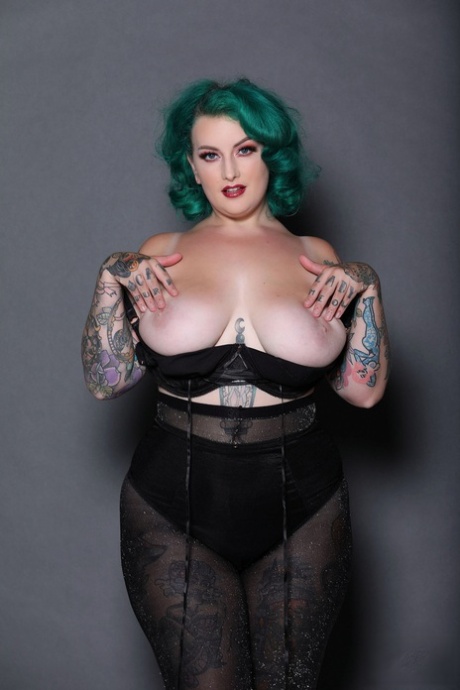 Green haired chubby babe Galda Lou shows her inked body and big tits