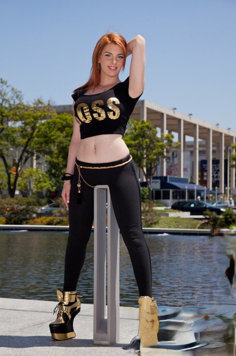 In public, Lilith Lust from Redhead is seen wearing seductive black leggings and high heels.