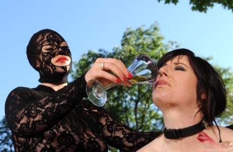 In an outdoor BDSM match, Maid Samantha Bentley is made to drink her own urine.