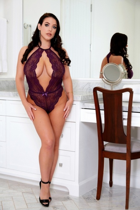 On a chair, Angela White, a well-known curvy pornstar, lets her tits and masturbate.