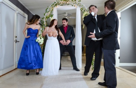 During the wedding ceremony, Angela White receives an analysis and has her big moments rattled off by music.