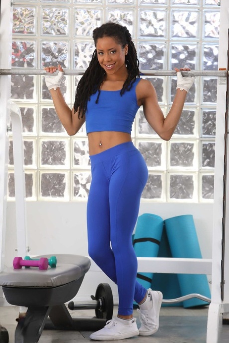 Fit ebony teen Kira Noir strips during her intense workout at the gym #3