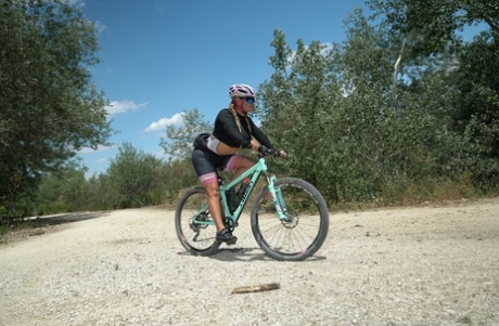 MILFs Alexa Blun and Nikyta leave their bikes and ensnare a fellow cyclist in a 3some.