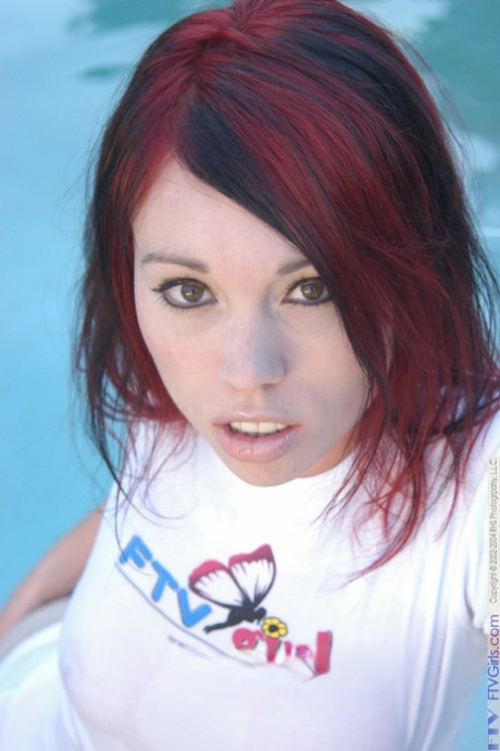 Sweet redheaded teen Rose masturbates with a water hose in a wet shirt