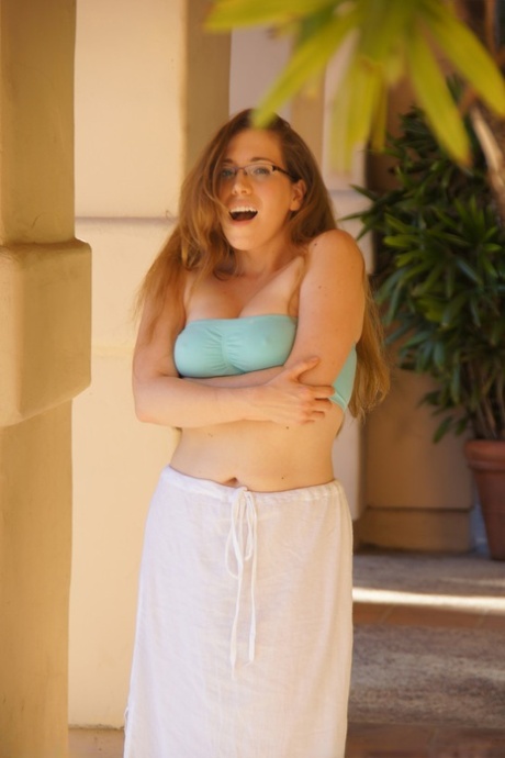 With a curvy MILF and glasses on, Samantha is tightening her large breasts as she goes for a walk.