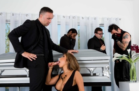 The Akira Lane coffin bears a seductive Asian MILF with big tits.