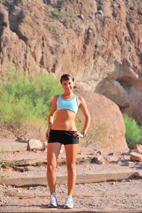 The brunette-faced Melina flaunts her buttock while hiking.