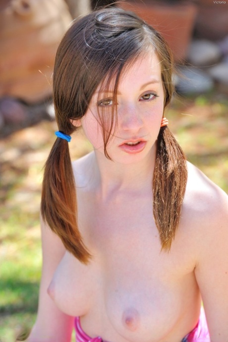 Teen with pigtails Victoria reveals her nice tits & plays with a water hose - PornHugo.net