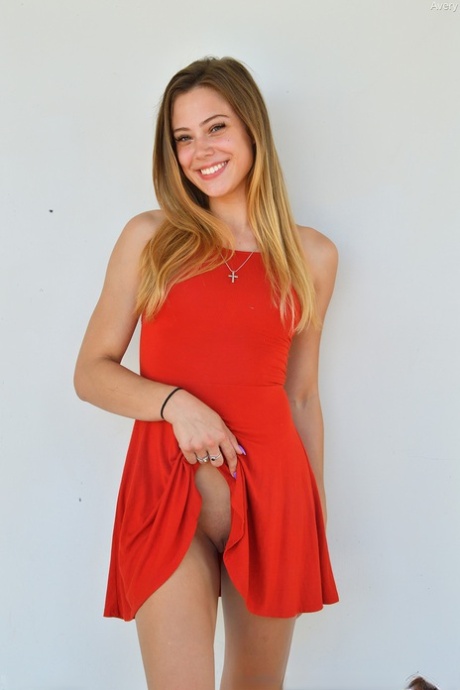 Adorable amateur teen in a red dress Avery flashes her bum and twat