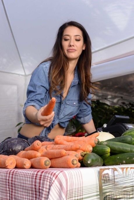 Eva Lovia, the stunning wife of a farmer, is rammed while shopping for vegetables at the market.